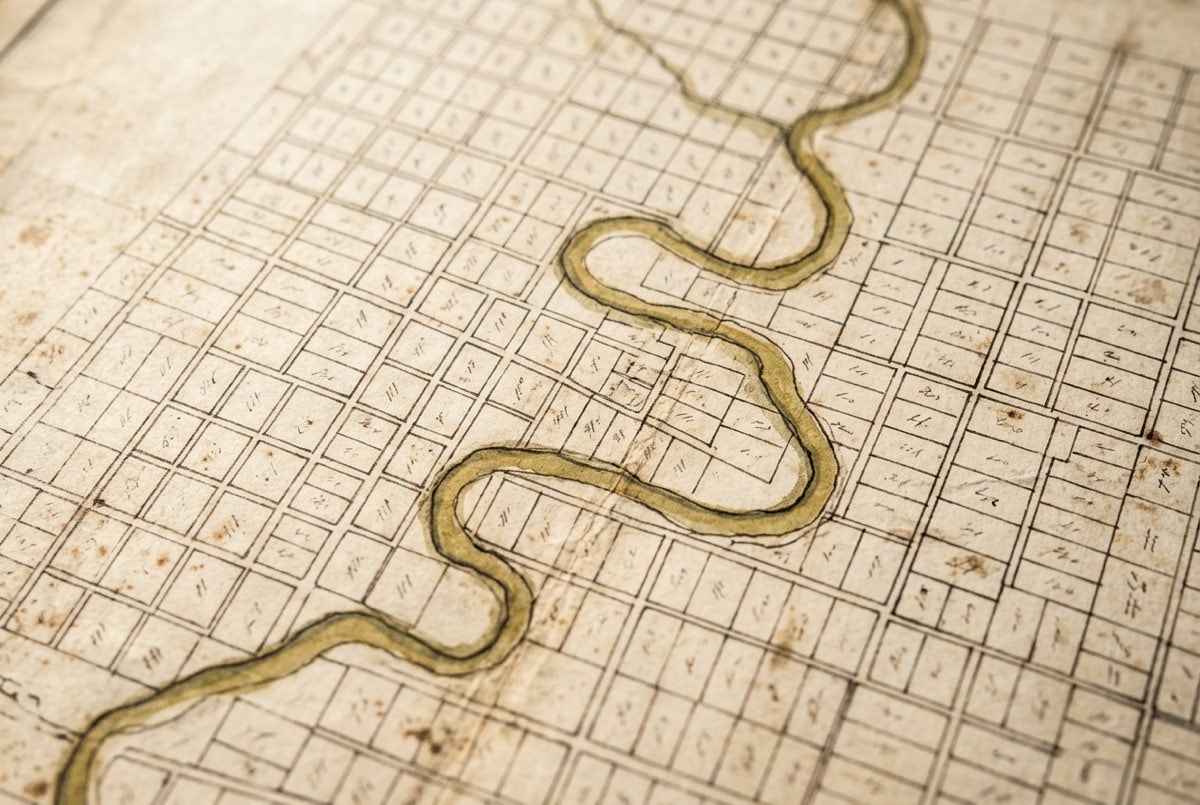 Detail of an antique surveyed land lot plat map on aged paper